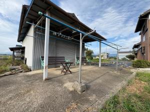 a patio with a picnic table in front of a building at Kohaku - Vacation STAY 20481 in Nagahama