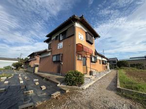 a building that is sitting on the side of a road at Kohaku - Vacation STAY 20499 in Nagahama