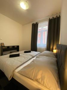 Ένα ή περισσότερα κρεβάτια σε δωμάτιο στο Hotel Central