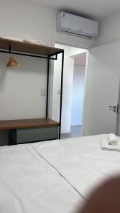 En eller flere senge i et værelse på Apartamento completo – perto do centro de Bauru