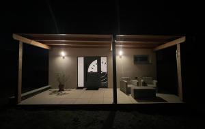a view of a living room at night at Bungalov SOLARIS - Kuchařovice u Znojma in Kuchařovice +6 photos