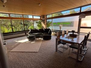 a living room with a couch and a table at Urban Oasis Friedberg in Friedberg