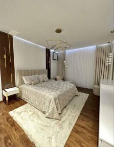 Ένα ή περισσότερα κρεβάτια σε δωμάτιο στο Asila hotel