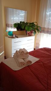 Ένα ή περισσότερα κρεβάτια σε δωμάτιο στο Home