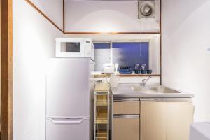 Η κουζίνα ή μικρή κουζίνα στο Ashigarashimogun - Apartment - Vacation STAY 75007v +17 φωτογραφίες