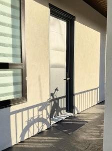 a shadow of a bike on the side of a building at Excellent Place to Stay in Coquitlam