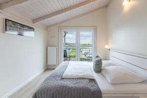 Ένα ή περισσότερα κρεβάτια σε δωμάτιο στο Strandgut