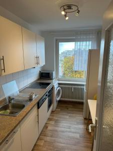 Η κουζίνα ή μικρή κουζίνα στο Kaiser-Rooms Dresdener Ring 3 6OG Nähe VW Werk