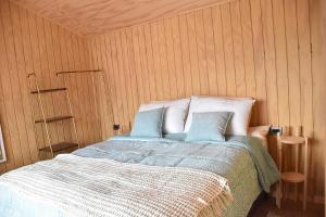 Ένα ή περισσότερα κρεβάτια σε δωμάτιο στο Cabaña Vista Playa Curiñanco