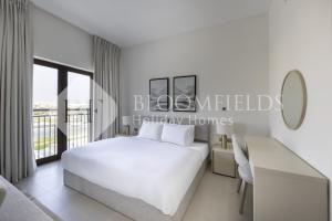 Ένα ή περισσότερα κρεβάτια σε δωμάτιο στο Bloomfields Cozy StuYas Golf Collection