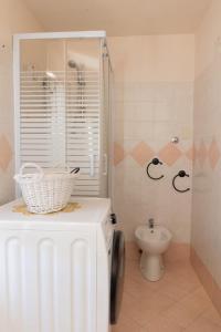a bathroom with a shower and a toilet in it at Residenza Le Fontane in Ceppo Morelli