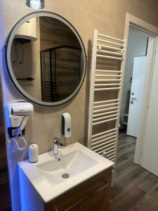 a bathroom with a sink and a mirror at Harmony in Trieste