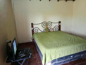 Ένα ή περισσότερα κρεβάτια σε δωμάτιο στο Rancho Felicia y Moisés