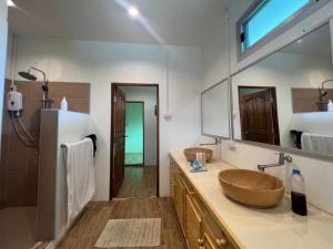 a bathroom with two sinks and a large mirror at Creek Cottage Chaeson in Ban Mun Thung +165 photos