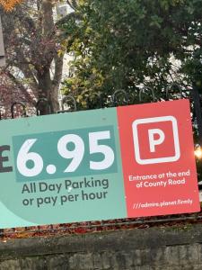 a sign for a day parking or pay per hour at Modern Studio - Centre Maidstone in Maidstone
