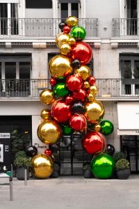 a christmas tree in front of a building at Hotel Regina in Madrid