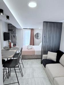 Ένα ή περισσότερα κρεβάτια σε δωμάτιο στο G&E Kavala Apartments