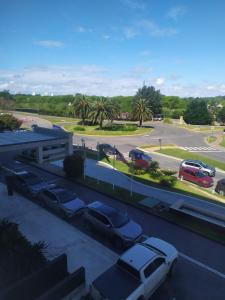 a parking lot with cars parked in a parking lot at NORDELTA BAHIA GRANDE Monoambiente con cochera in Benavídez