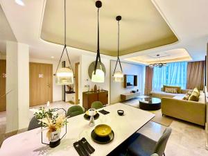 a living room with a table and a living room at Modern Elegance Luxury Living City Center in Tangier