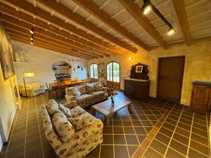 a large living room with couches and a table at Menorca Agroturismo Llimpet in Alaior