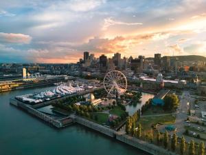 an aerial view of a city with a ferris wheel at McGill Les petits studios in Montréal