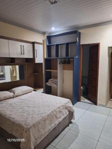 a bedroom with a bed and a bunk bed at Recanto Morada Amazônica in Manaus