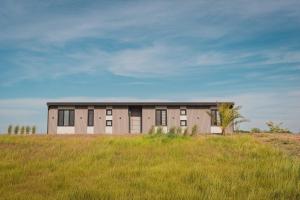 a building in the middle of a field at Carmelo Golf by Puerto Dijama in Colonia Estrella