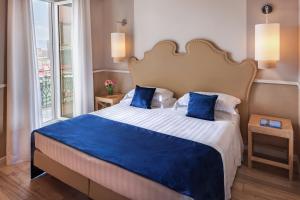 Giường trong phòng chung tại Starhotels Terminus