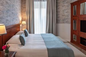 Giường trong phòng chung tại Starhotels Terminus +67 ảnh