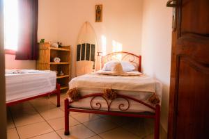 Ένα ή περισσότερα κρεβάτια σε δωμάτιο στο Surf Away Morocco +15 φωτογραφίες