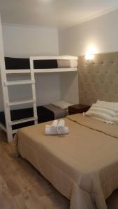 Postel nebo postele na pokoji v ubytování HOTEL RESTAURANTE Ruta 66