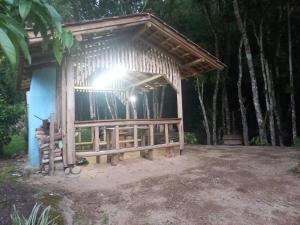 a small hut with a light on top of it at Sitio Daniela in São João Batista +4 photos