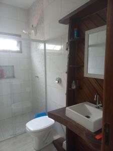 a bathroom with a toilet and a sink and a shower at Sitio Daniela in São João Batista