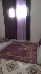 Giường trong phòng chung tại شقة في بني بوعياش +2 ảnh