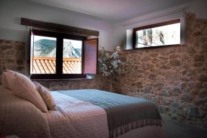 Postel nebo postele na pokoji v ubytování El Charcon Alojamiento Rural