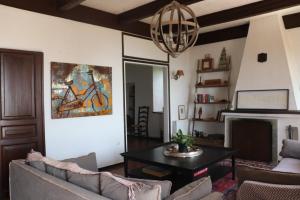 a living room with a couch and a table at Pelion country house in Volos