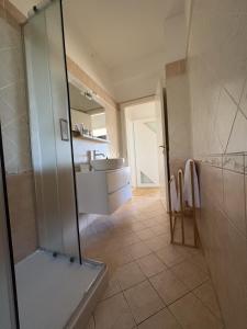 a bathroom with a shower and a sink at Appartamento DIMORA GUIDI 3 camere 2 bagni URBINO in Urbino +26 photos