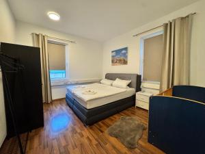 Ένα ή περισσότερα κρεβάτια σε δωμάτιο στο City-Apartment Kassel Direkt im Zentrum
