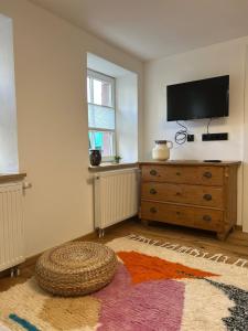 Μια τηλεόραση ή/και κέντρο ψυχαγωγίας στο Ferienwohnung in Mühleneck