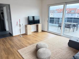 TV a/nebo společenská místnost v ubytování Zentral gelegenes Design-Loft für höchste Ansprüche