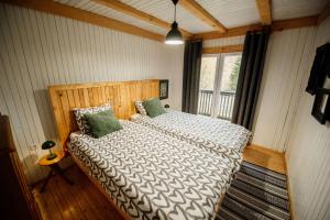 Ένα ή περισσότερα κρεβάτια σε δωμάτιο στο Forest Hill kuća za odmor na Zlataru