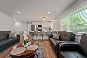 a living room with a couch and a table at Exceptional Willowbrook Retreat in Willowbrook