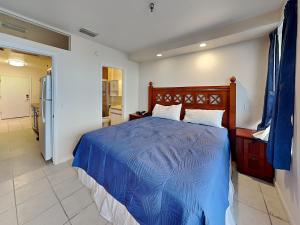 En eller flere senge i et værelse på Harbour Beach Resort 105