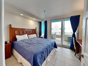 En eller flere senge i et værelse på Harbour Beach Resort 105