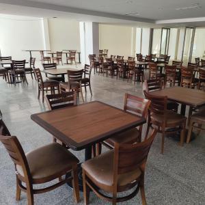 a dining room with tables and chairs and tablesktop at Hotel Azul Agave Oaxaca in Yelateni