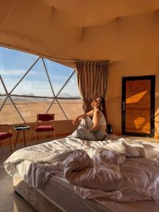 Ένα ή περισσότερα κρεβάτια σε δωμάτιο στο Whisper Dunes Camp