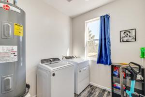 a laundry room with a washer and dryer and a window at Hike and Ski! Home with Dog-Friendly Yard in Eagar in Eagar