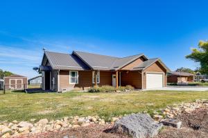 a brown house with a metal roof on a yard at Hike and Ski! Home with Dog-Friendly Yard in Eagar in Eagar