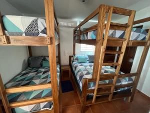 En eller flere senge i et værelse på Mar y Cielo Beach House