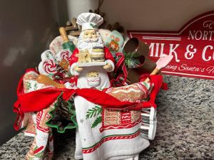 a santa claus figurine sitting on a counter at A Beary Good Getaway condo in Pigeon Forge +74 photos
